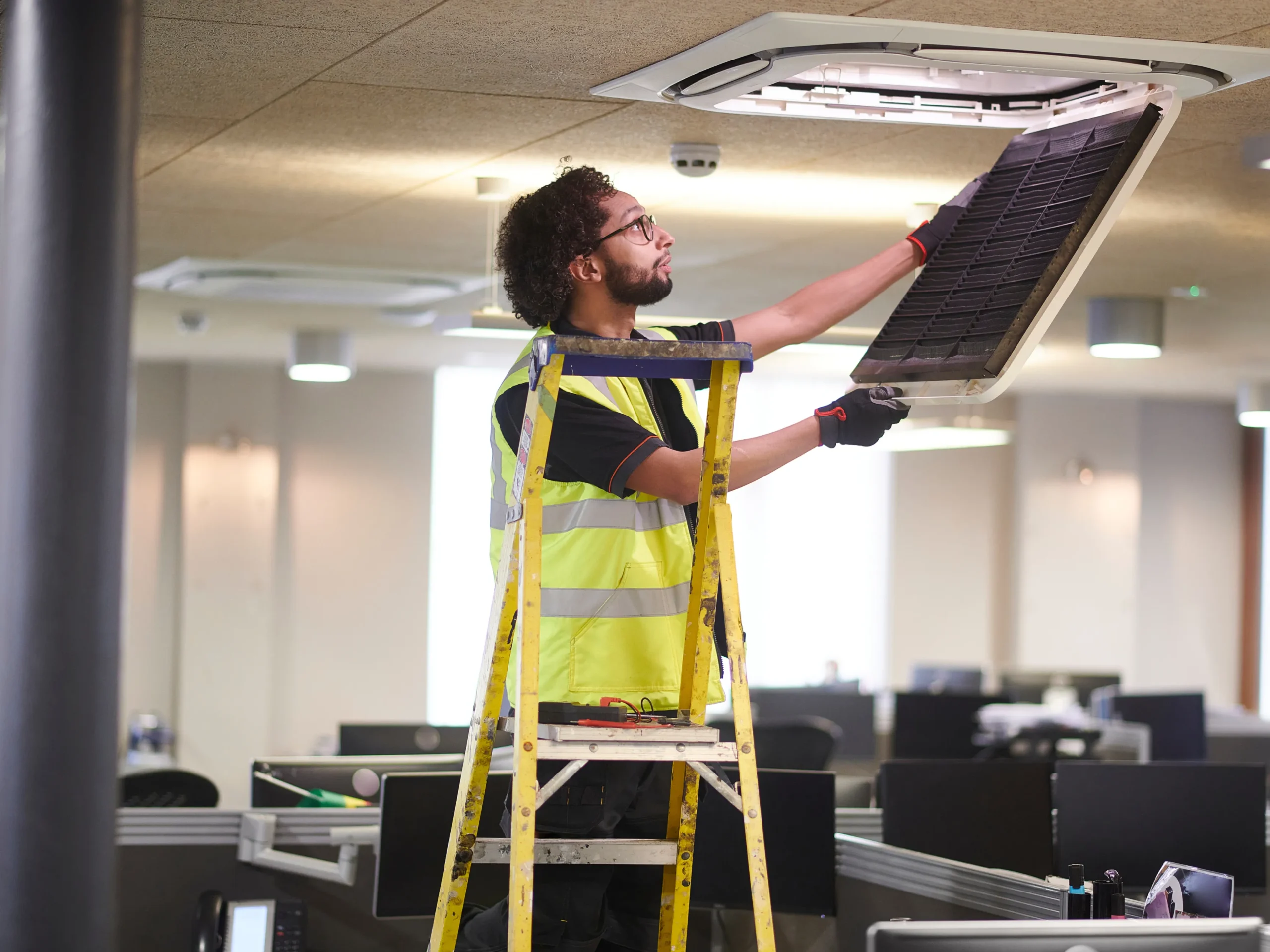 man performing building maintenance