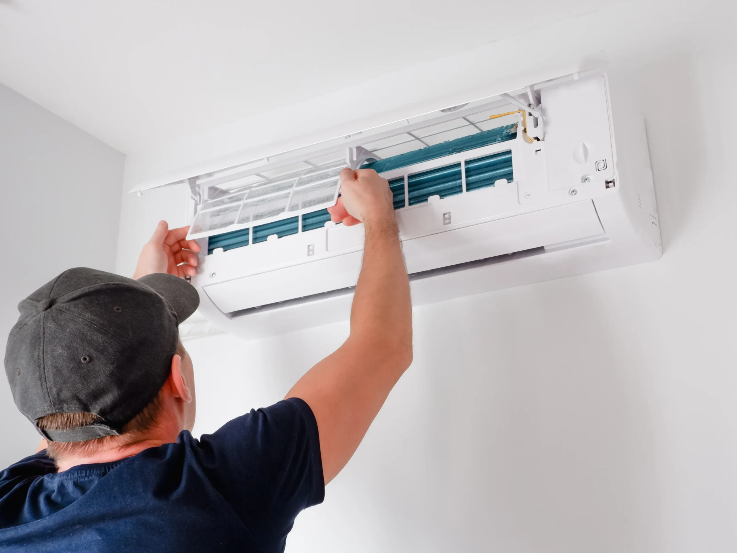 HVAC system cleaning done by man