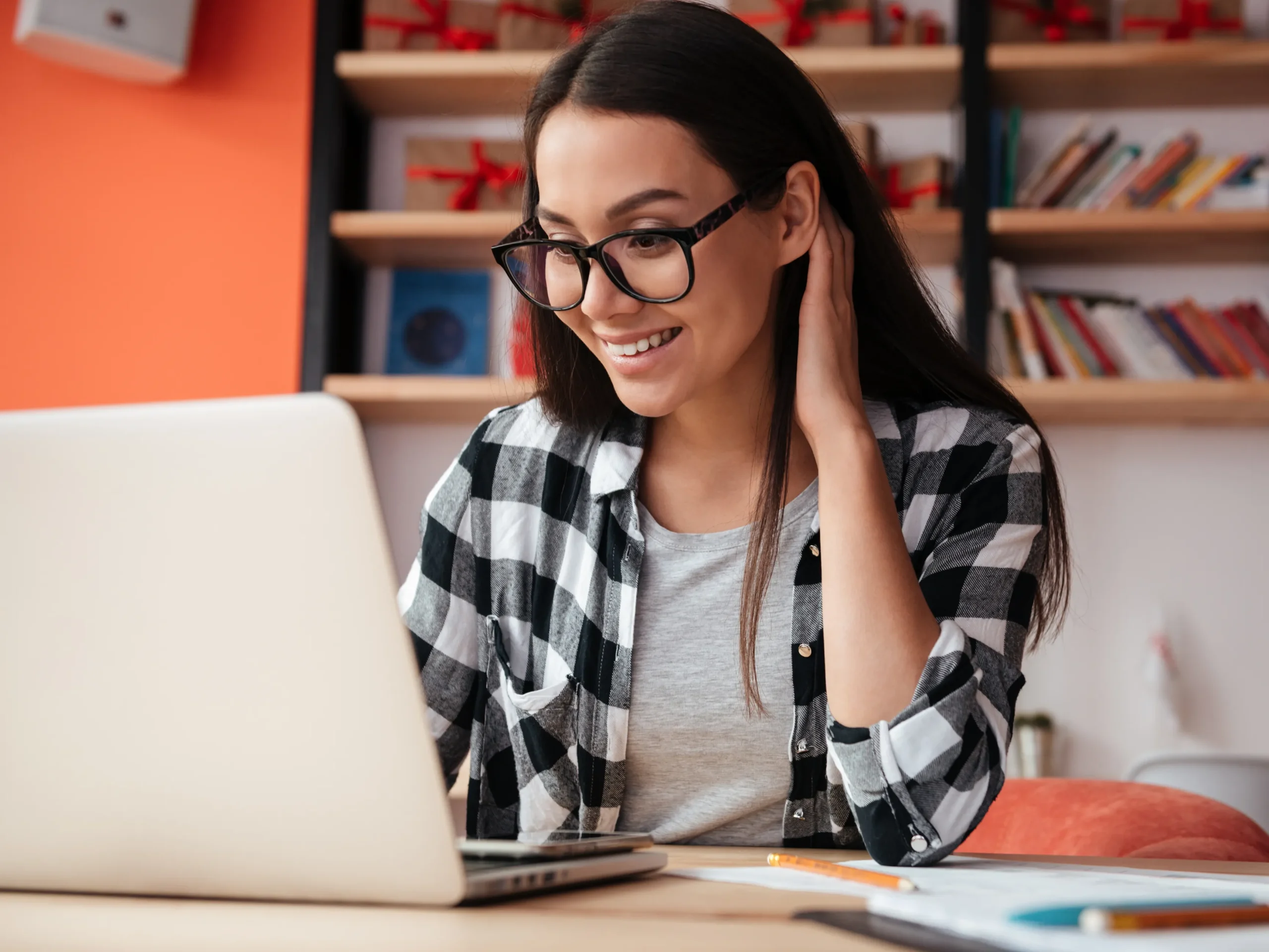 man scheduling hvac system cleaning on laptop - smiling