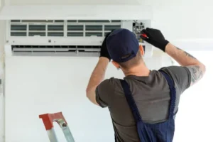 hvac maintenance guy fixing ac
