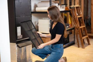 person checking the air filter