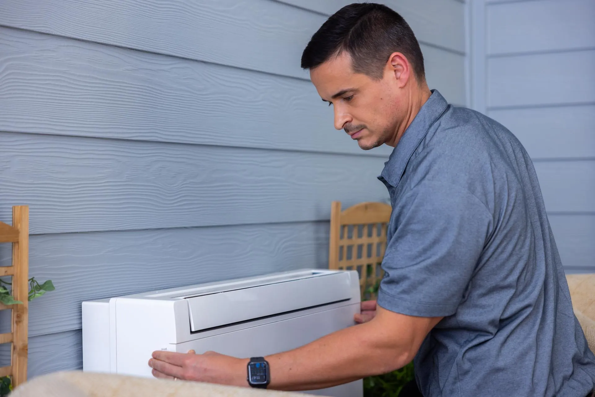Technician working on HVAC system for air conditioning repair