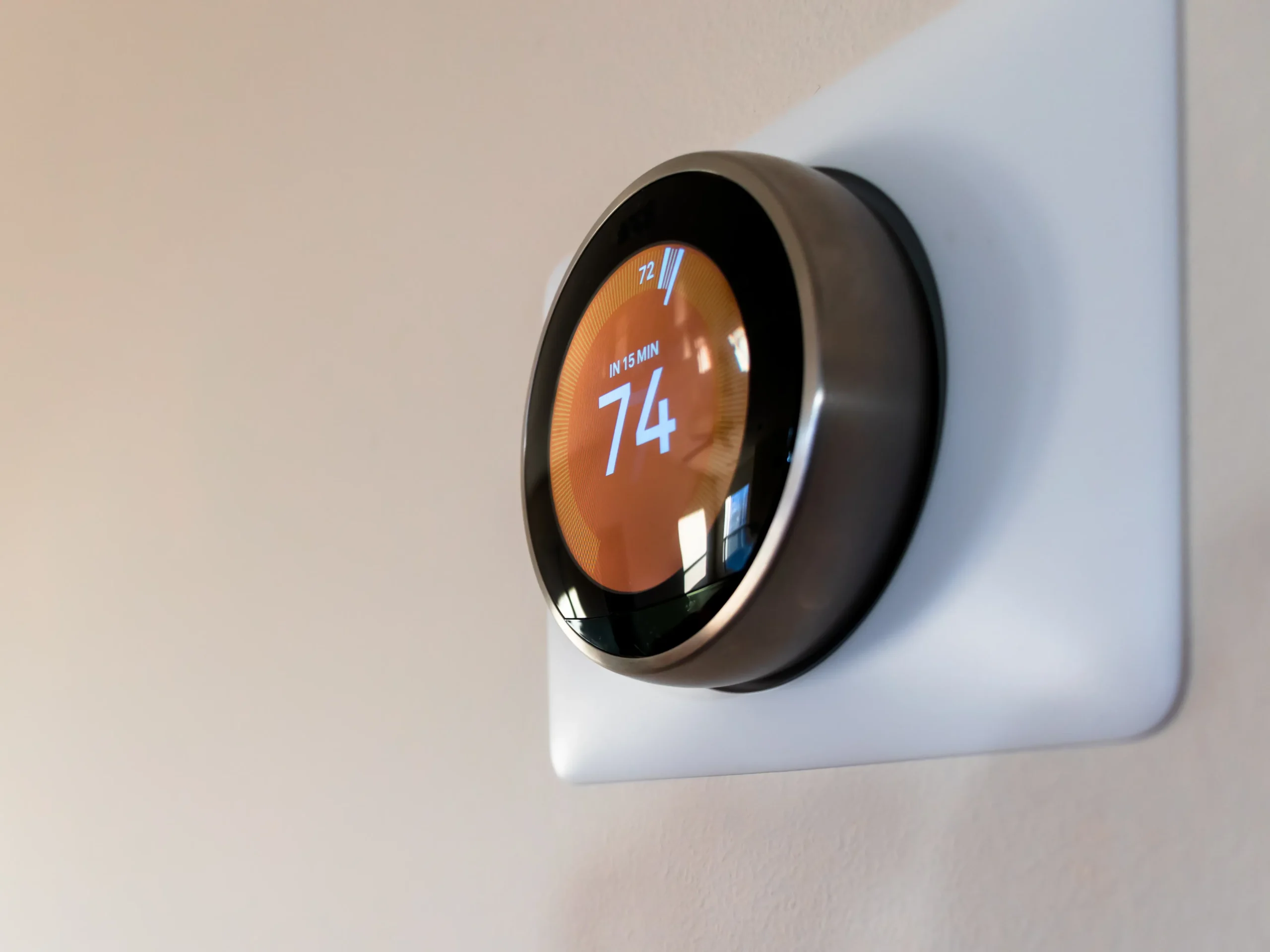 thermostat on wall set at 74 degrees