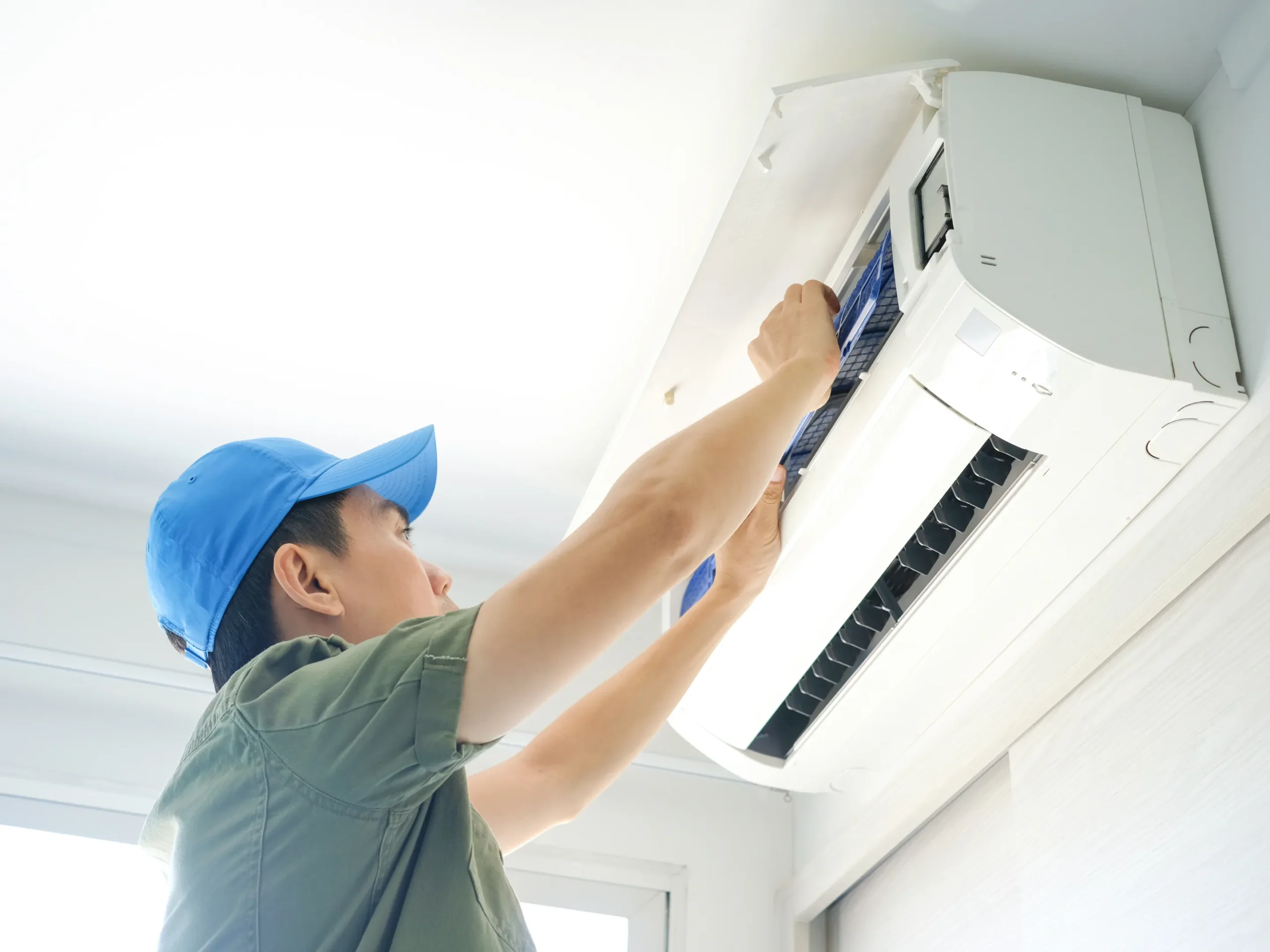 hvac technician working on ductless unit