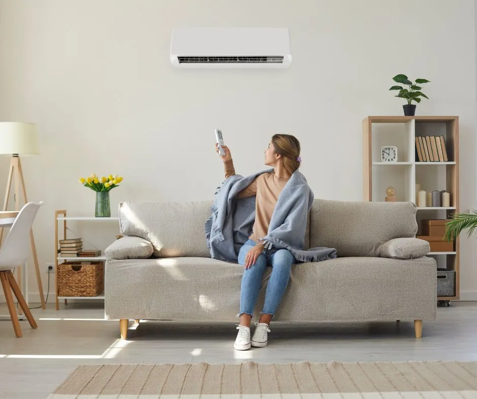 woman adjusting hvac system
